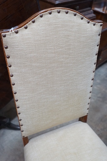 A set of six 18th century style oak dining chairs, with cream upholstered seats and backs